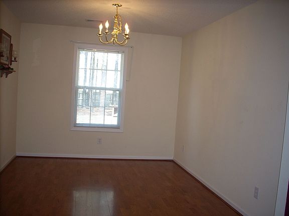 Formal Dining Room With Hardwood Flooring