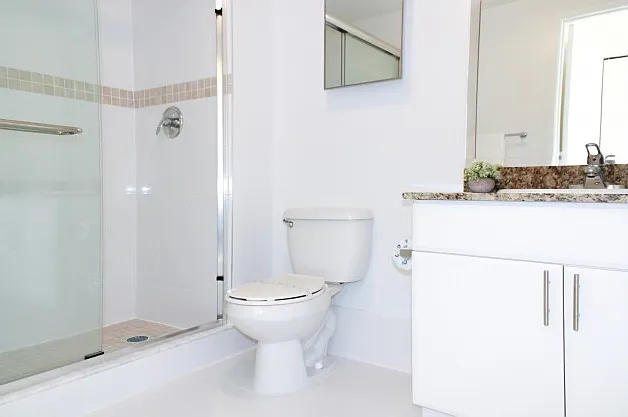 Bathrooms with Granite Countertops & Glass Shower Enclosures