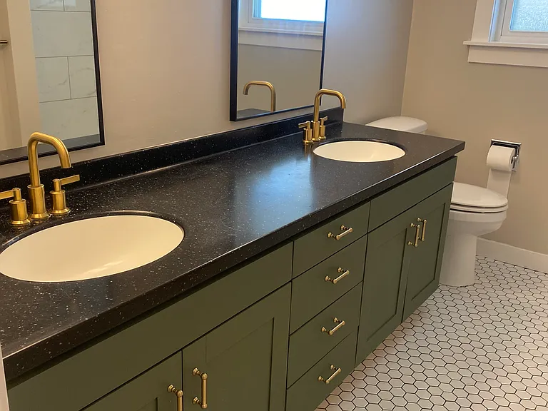 Hall bathroom on main level. Amazing tile, vanity, hardware, mirrors!