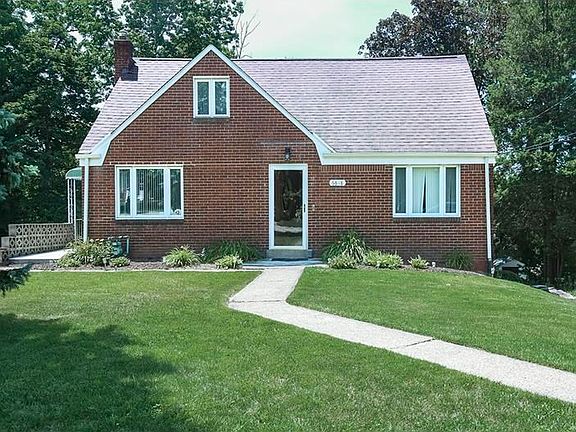 Front Exterior: This 3 bed, 2.5 bath has great curb appeal! Level entry, concrete sidewalk and long concrete driveway to parking pad and rear entry, one car, integral garage. Walk two blocks to South Park! Minutes from South Park Golf Course, shopping and