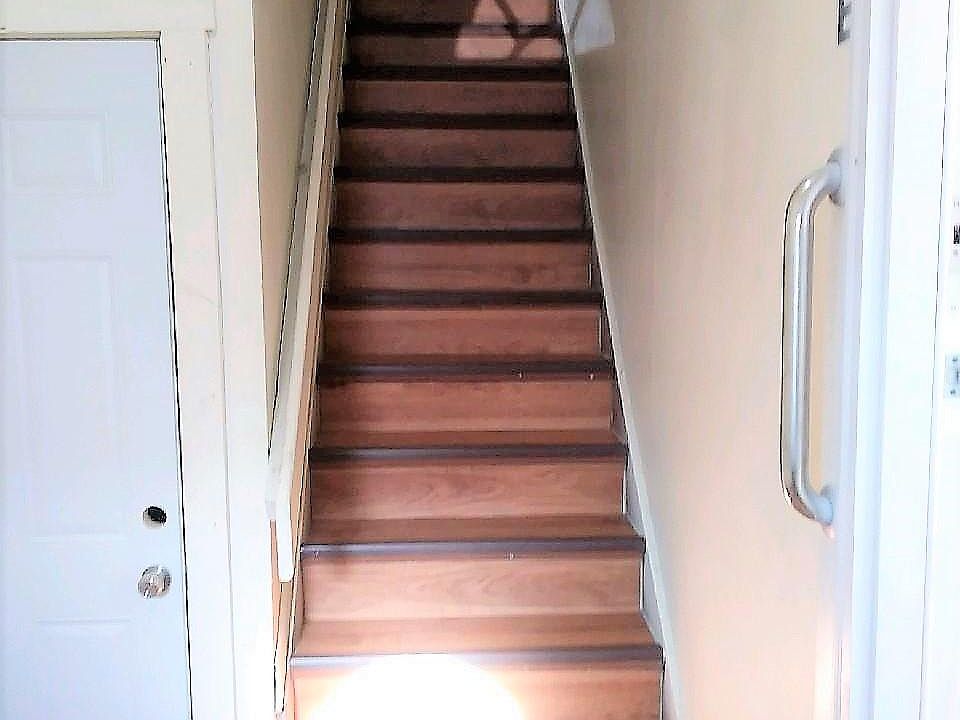 Main Entry Foyer and Steps to 2nd Floor Apartment Entry