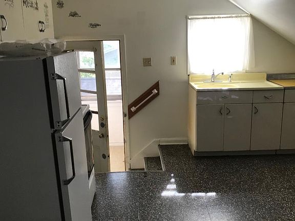 Refrigerator and stove included.