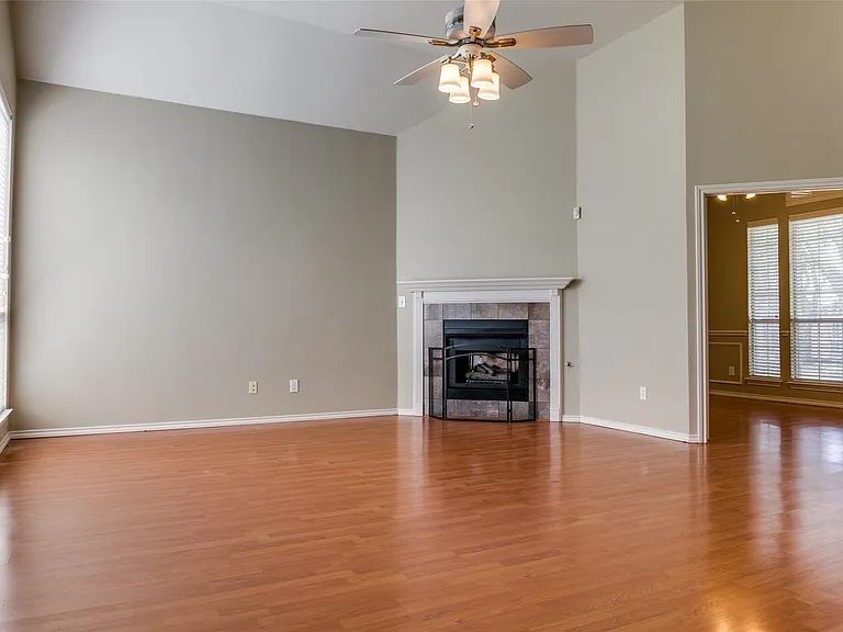 Living room has fireplace with gas logs.