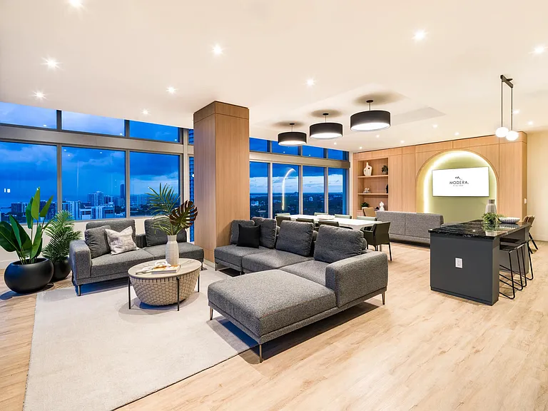 Expansive resident lounge at Modera Riverside with sweeping Miami views, ideal for relaxing or hosting with style.