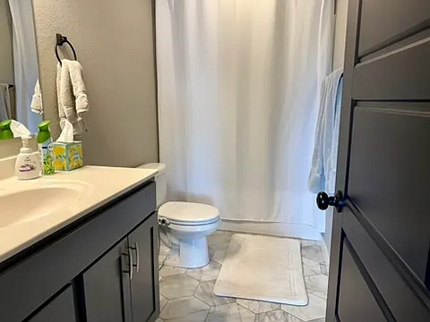 Main floor bathroom with tub/shower combo