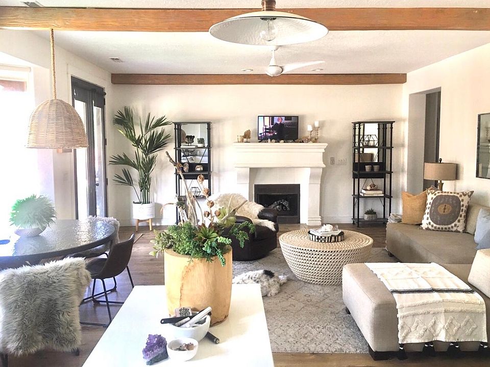 Light filled open modern floor plan with 9_ ceilings, gas fireplace and panoramic views