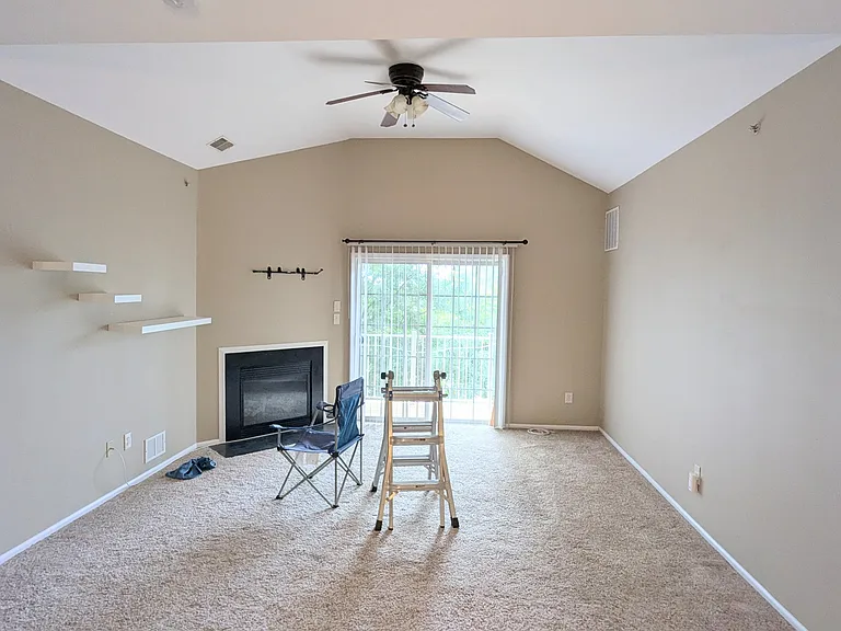 Living Room with 13 ft Ceilings and place for mounting a 55 inch TV