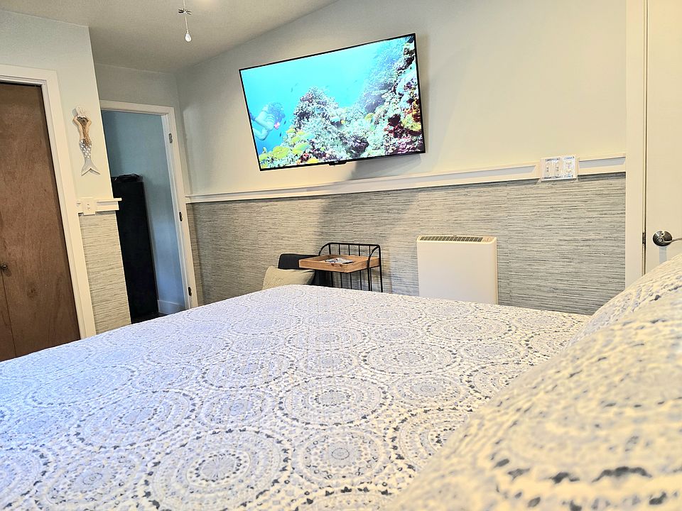 Adjustable wall mounted Roku TV.