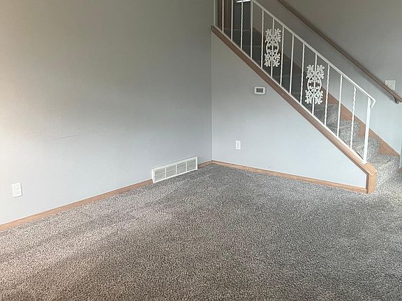 Living room, going up to 2 bedrooms and bathroom