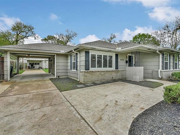 Covered parking beyond the garage door. Additional parking pad for secondary vehicle. Driveway holds up to 5 vehicles.