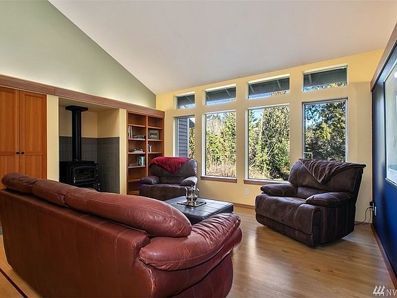 Living Room with Gas Wood Stove, Maple Hardwood Floors & Open Beam Ceiling