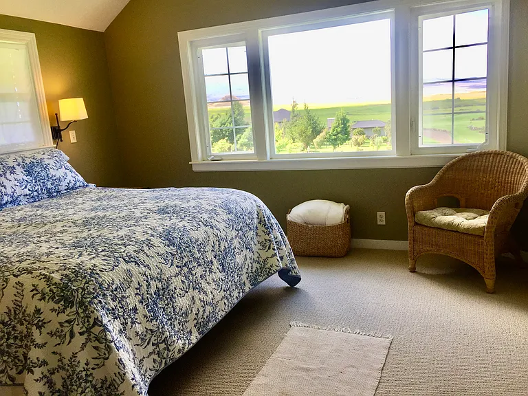 Master bedroom with a view of Moana Kea and Moana Lea. En-suite bathroom with tub and shower (not pictured)