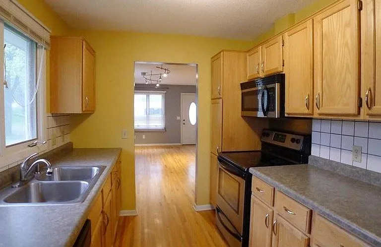 Spacious galley kitchen with large eat-in area