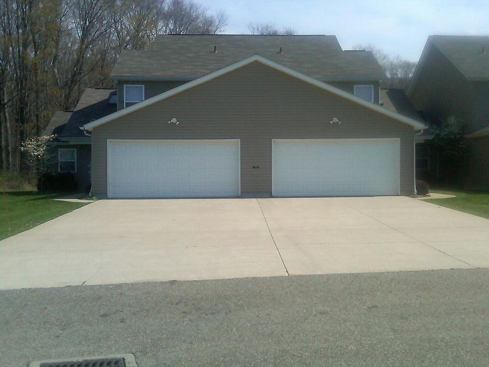 Front of Two car garage with opener