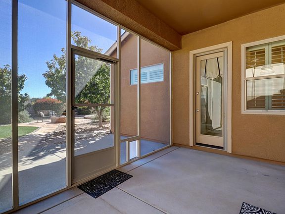 Screened porch to back yard.