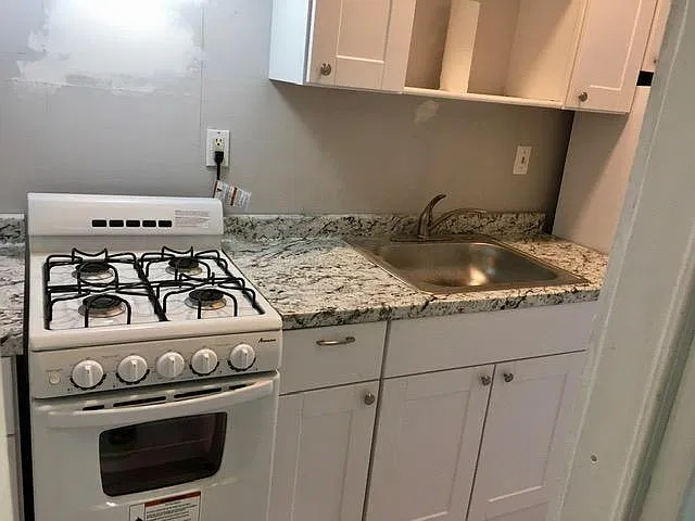 Lots of storage in kitchen (wall will be painted where spackling is seen)