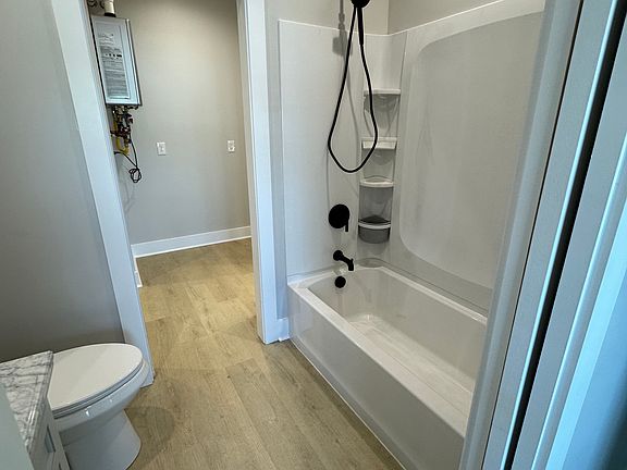 2nd Bathroom features a tub shower combo with pocket doors. Located off the laundry room and garage.