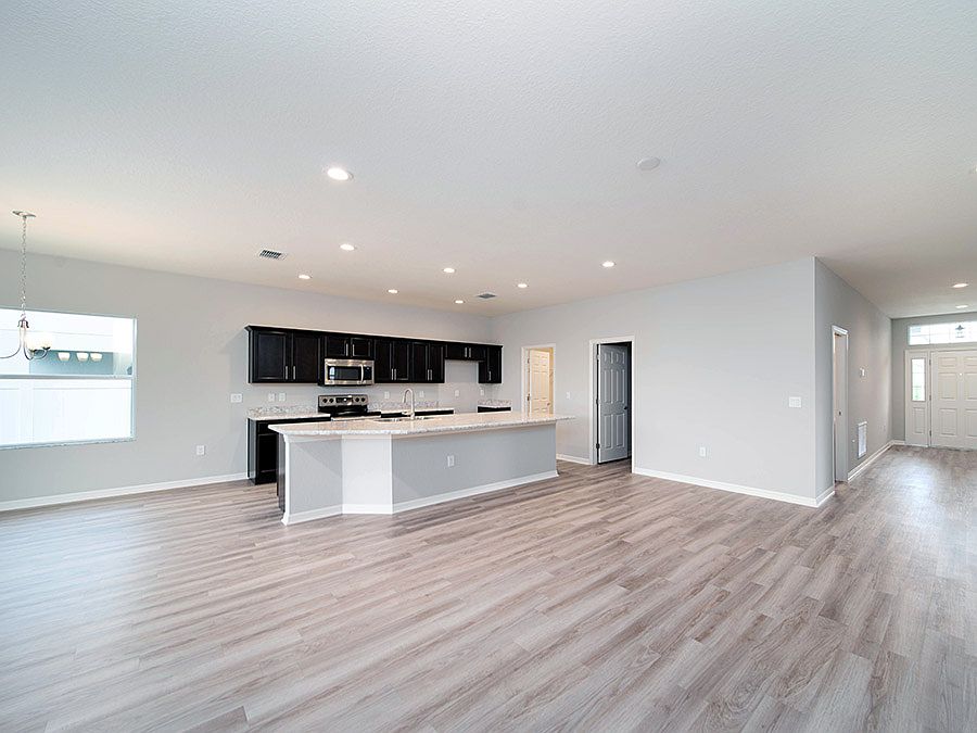 Brand-new 4-bedroom home for sale in Lake Alfred, FL - Photo showcases a home with similar finishes.