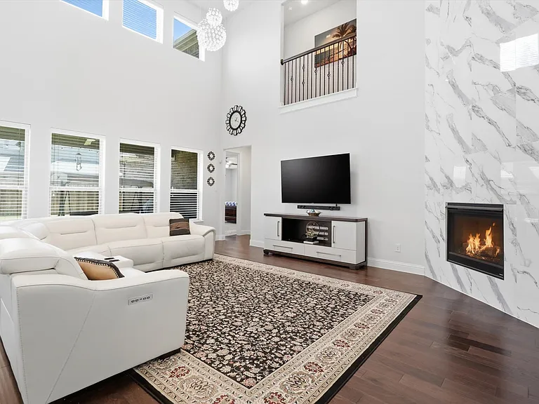 Living Room with Floor to Ceiling Fireplace Tile