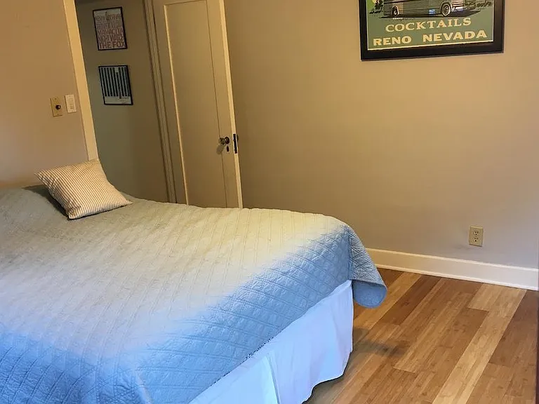 One of two bedrooms that open up to wooden deck