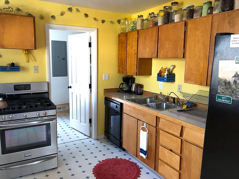Kitchen, door to laundry room and then backyard