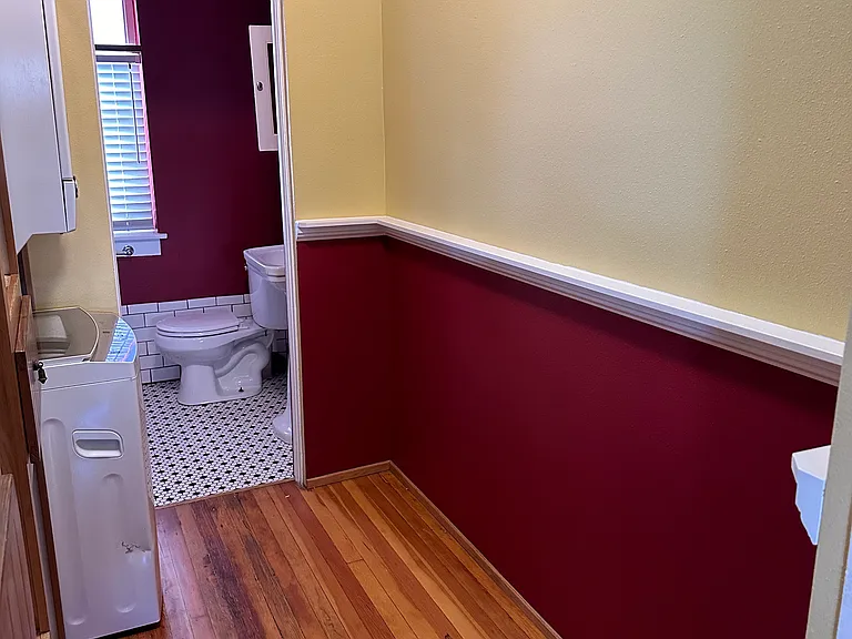Chair rail has a ledge that acts as a small shelf for small personal items