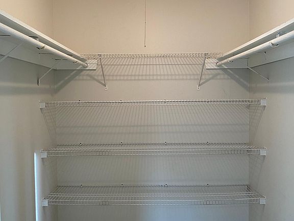Spacious walk-in closet in the master bedroom
