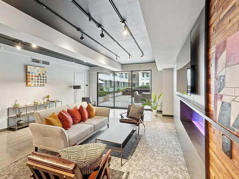 Unwind in the vibrant resident lounge, complete with cozy seating and direct access to the courtyard.