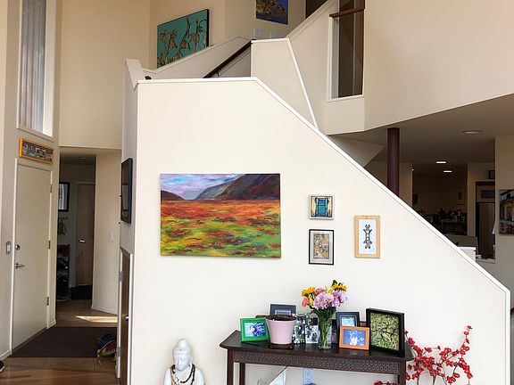 View from the couch looking up the staircase to the upstairs bedrooms