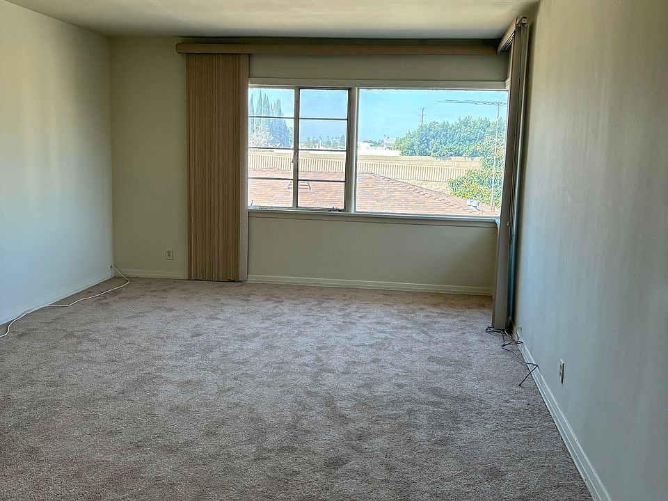 large living room plenty of sunlight. also a window to the right
