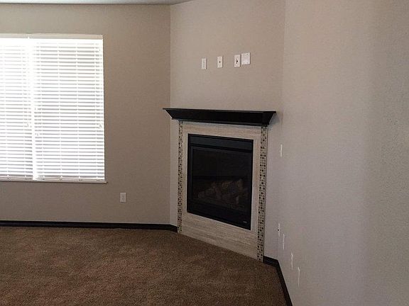 Living Area (featuring vaulted ceilings and gas fireplace)