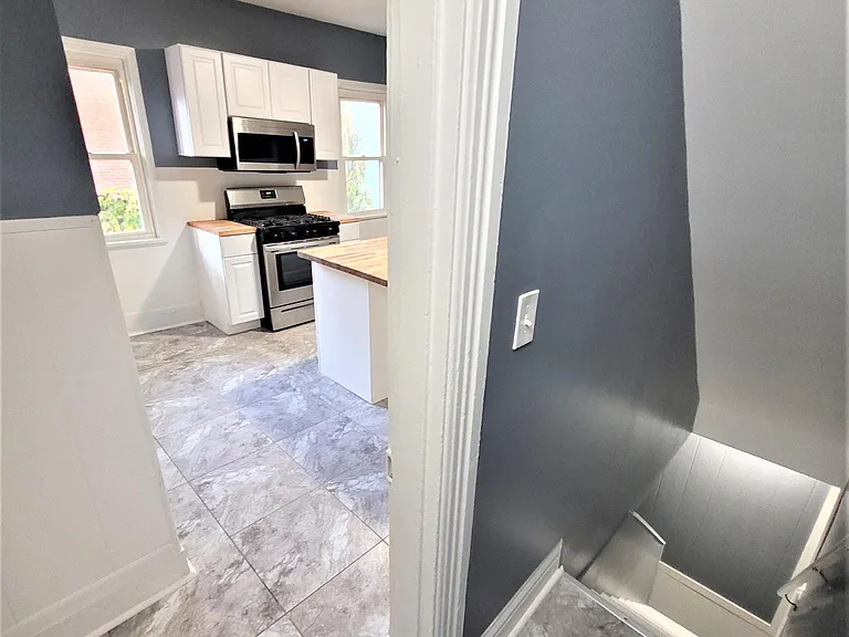 Kitchen and stairs to basement