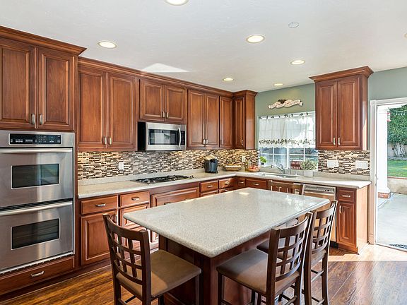 Stainless appliances, custom cabinets, and granite countertops.