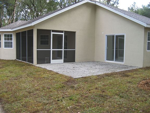 back porch with screen room and extended porch for grilling or jacuzzi
