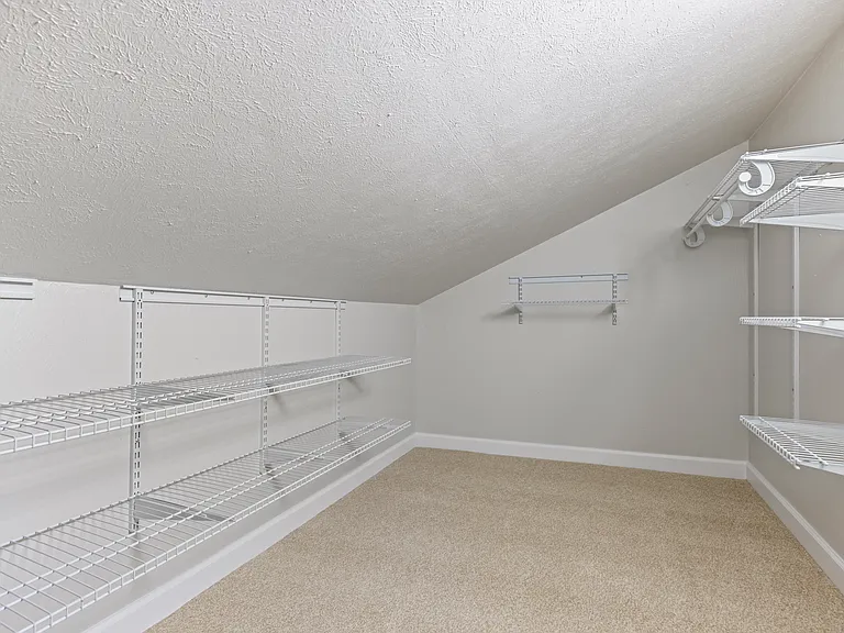 primary bedroom walk-in closet