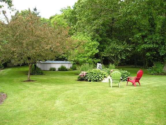 Deep backyard with above gro