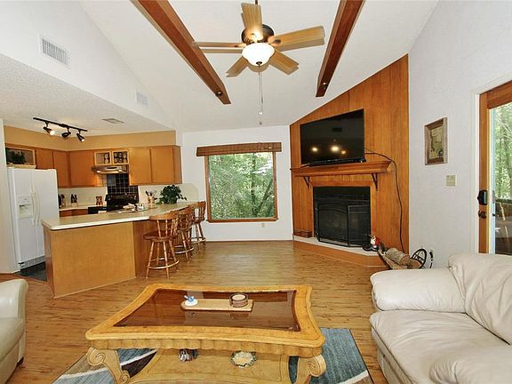Another large picture window near the kitchen also features scenic views for a relaxing ambiance.