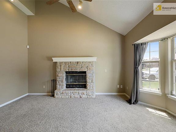 Great Room with Stone Fireplace, Vaulted Ceiling, Bay window allows more furniture placing.