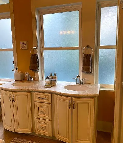En suite master bathroom. View from bedroom. Lots of natural light. Added in 2014.