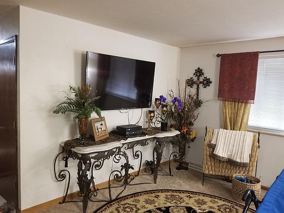 huge white marble side table also includes large 4K LED HDTV