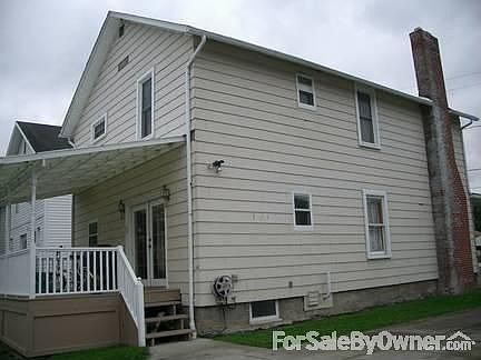 Rear view from driveway : Shows rear covered deck