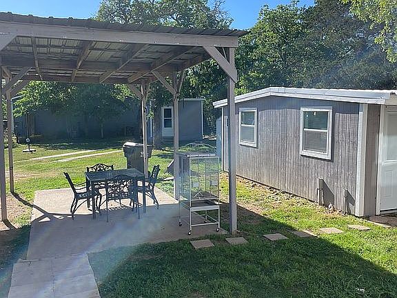 Car port and outbuilding 1