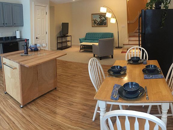 Kitchen is fully equipped with a new Bosch dishwasher, frost-free refrigerator/freezer, disposal, flat top stove and both a full-sized electric oven and built-in microwave ovens. The kitchen also has a butcher block mobile island and is stocked with plate