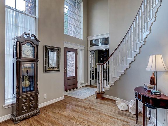 Custom details throughout the home such as a sculptured winding staircase and crown molding.