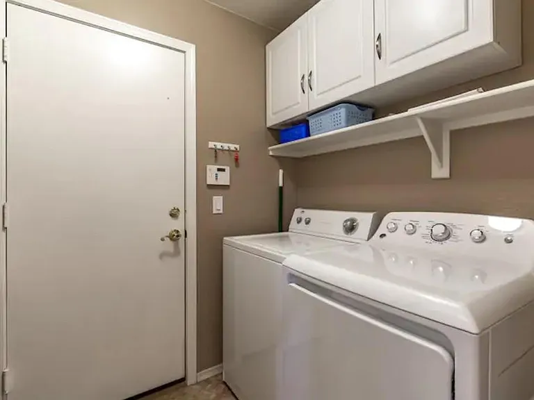 Laundry room with full size washer and dryer.