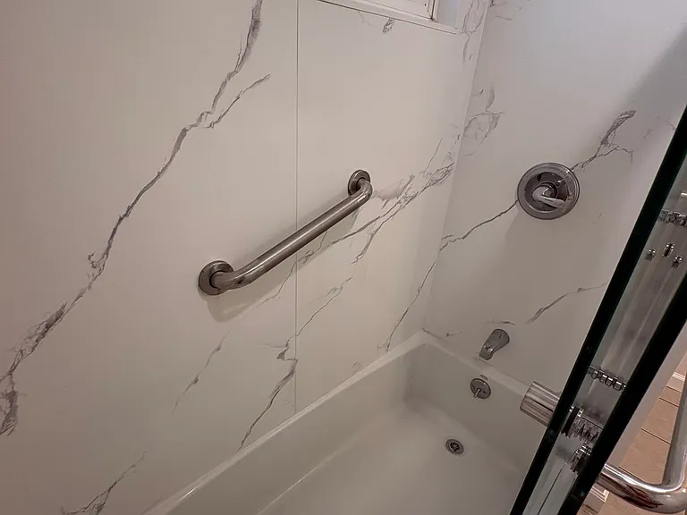 Shower over tub combination, Delta single handle shoer valve, grab bar