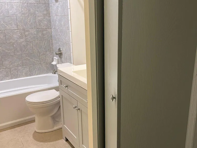 Brand New Shower and Full Bathtub. New Toilet and Vanity with Stone Sinks. Linen Closet in Bathroom.