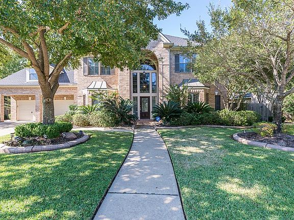 Fabulous four/five bedroom, 3.5 bath, 3-car garage home with pool overlooking the lake!