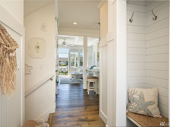 Welcoming entry flows through to the sand-swept floors right out onto the rear view deck.