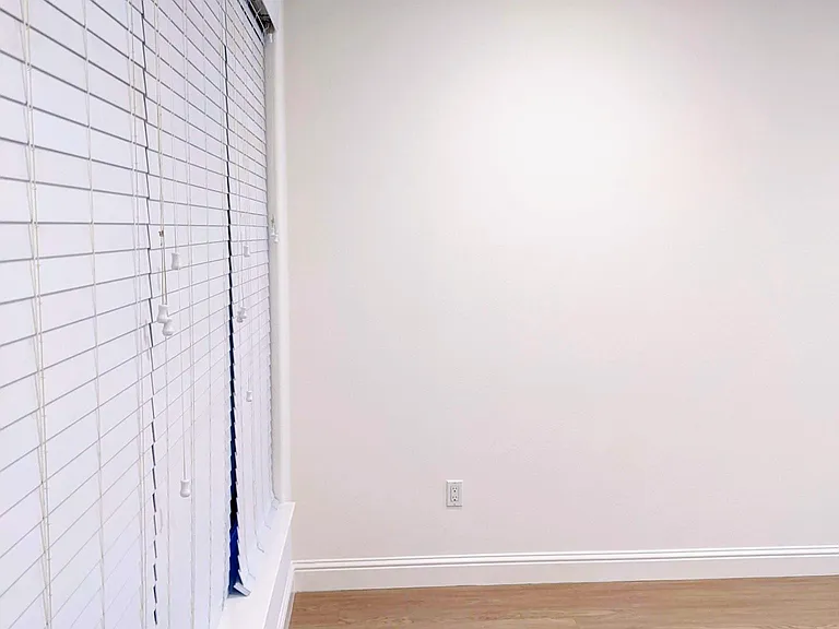 Living room. High quality vinyl blind window treatments throughout the house.